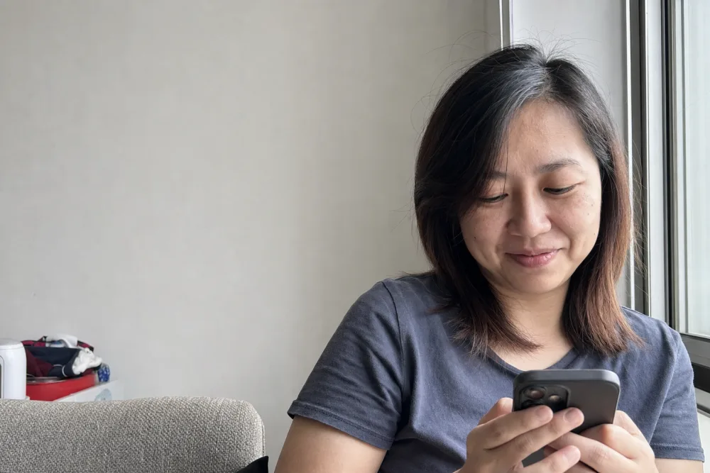 Woman comparing personal loan offers on her phone